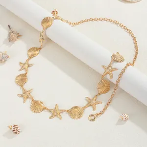 Bohemian gouden metalen bodychain met zeester en sint-jakobsschelp bedels voor strand