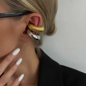 European style C-shaped ear cuffs with threaded and molten textures in gold and silver.