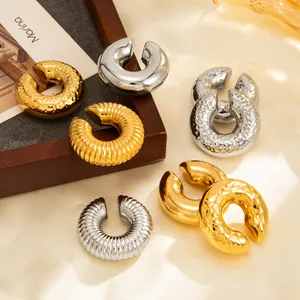 Stainless steel C-shaped ear cuffs with textured and smooth gold and silver finishes