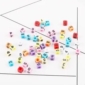 Detailed view of colorful acrylic square beads with printed numbers for DIY jewelry