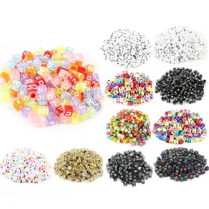 Macro detail showing a variety of colorful acrylic square alphabet and number beads for DIY