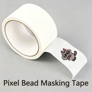 Macro view of white masking tape roll with perler bead owl figure for DIY crafts