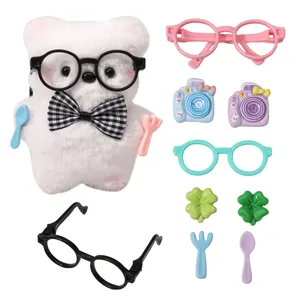 Detailed view of colorful cartoon resin DIY accessories including cameras and glasses