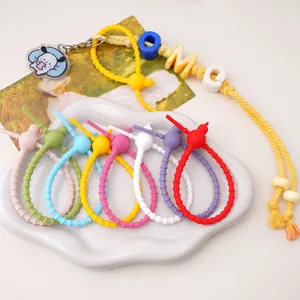 Close-up macro view of colorful silicone double-hole cable ties for DIY keychain accessories