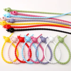 Colorful multi-purpose silicone ties shown in various vibrant colors and adjustable loops