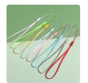Macro view showing a variety of colorful polyester lanyards for mobile phones and keys