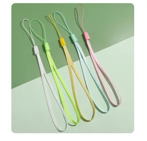 Detailed view of five assorted pastel-colored polyester lanyards arranged on green background