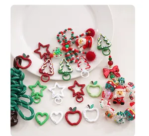 Variety of colorful Christmas-themed DIY keychain accessories, clasps, and cute charms