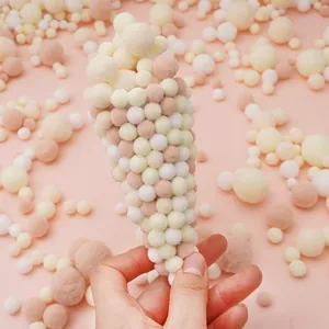 Macro view of soft colorful polyester pom-poms used for DIY handicraft decoration