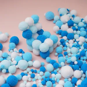 Macro detail of mixed blue and white polyester pompoms for kindergarten DIY crafts