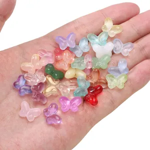 Perles papillon translucides de 10x14mm en verre coloré pour la création de bijoux
