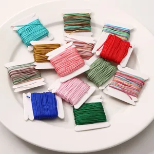 Close-up of assorted colorful 0.8mm nylon jade thread spools for DIY jewelry crafts