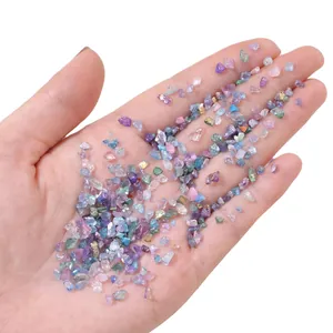 Close-up detail of irregular AB iridescent glass crushed stones for DIY nail art crafts