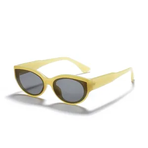 Vintage cat-eye sunglasses featuring light yellow frames and dark UV protection lenses