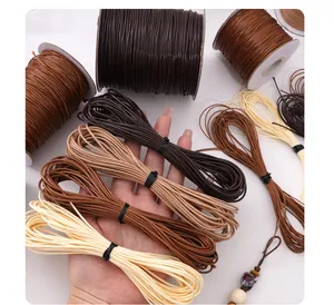Detailed view of assorted earthy-colored waxed cords for professional DIY jewelry weaving
