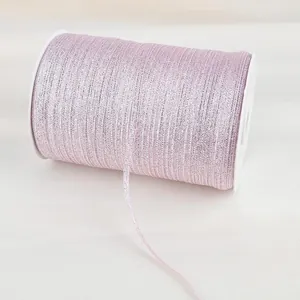 Close-up of 4mm shimmering pink metallic cord for gift wrapping and DIY crafts