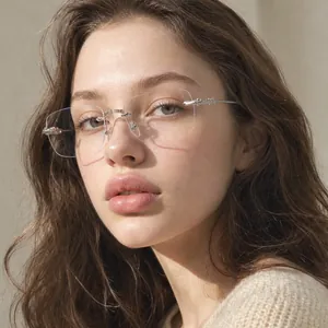 Detail of square rimless retro sunglasses with engraved temples on female model