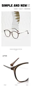 Detailansicht einer runden Retro-Brille mit bernsteinfarbenem Rahmen und Metallbügeln