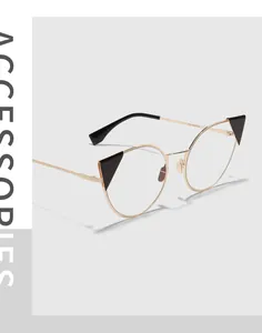 Side view of gold metal cat-eye glasses with unique black triangle accents on corners.