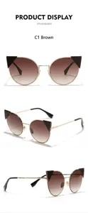 Detail view of stylish metal cat-eye sunglasses with brown gradient lenses.