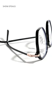 Detail view of the rose gold hinge on black TR90 square glasses frames