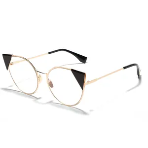 Stylish vintage cat-eye sunglasses with gold metal frame and unique black triangle accents