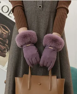 Warm purple winter gloves with faux fur trim for women's touchscreen use.