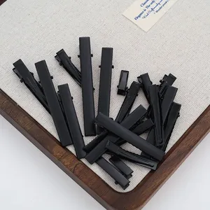 Detail view of premium matte black metal alligator hair clips for DIY hair accessory crafting