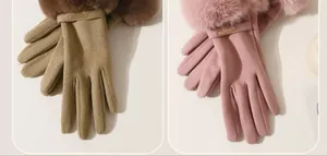 Detail view of stylish winter warm gloves featuring fluffy fur cuffs in khaki and pink.