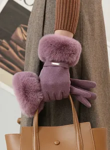 Detailed view of purple winter gloves with plush faux fur trim and suede finish