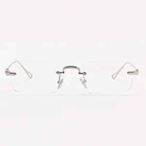 Detail of vintage rectangular rimless sunglasses with clear lenses and silver frame