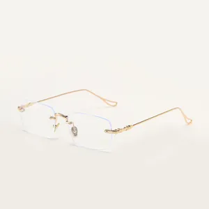 Retro rimless rectangular sunglasses with gold decorative temples and clear lenses