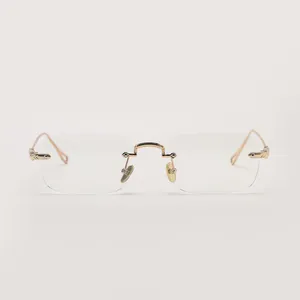 Retro rectangular rimless sunglasses with gold metal temples and clear transparent lenses