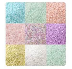 Multi-color glass cat-eye donut beads for DIY jewelry making in a decorative 3x3 grid view.
