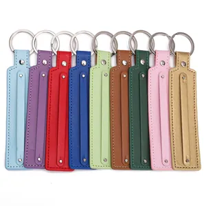 Selection of nine colorful faux leather wristlet keychains with silver metal rings