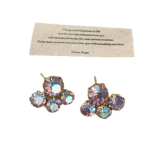 Elegant iridescent crystal flower stud earrings with gold-tone setting for women