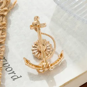 Close-up detail showing the back and pin mechanism of a creative gold alloy anchor brooch