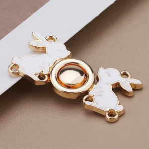 Close-up detail of a traditional white rabbit enamel metal buckle fastener for Hanfu
