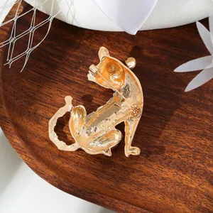 Detailed back view of a retro tiger brooch in gold finish showing the secure pin