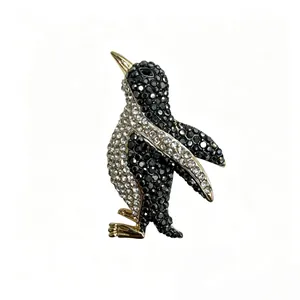 Cute penguin brooch with sparkling black and white rhinestones on gold alloy base