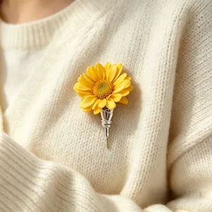 Detailed view of a creative silver DIY flower brooch holding a fresh yellow daisy