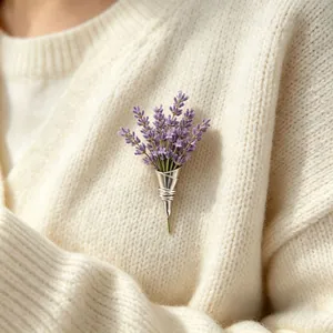 Close-up detail of a unique silver cone brooch holding lavender flowers on a knit sweater