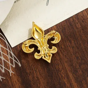 Elegant gold Fleur-de-lis brooch for men's suits with a textured vintage finish