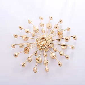 Back view of gold-tone snowflake brooch showing the secure pin fastener and structural design
