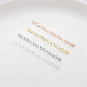 Detail of jewelry extension chains in gold, silver, and rose gold with teardrop charms