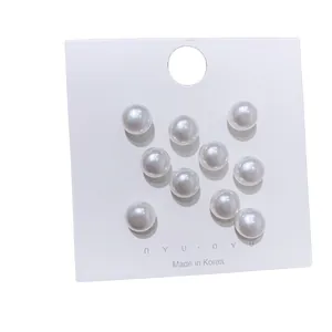 Elegant set of 10 white pearl anti-exposure brooches displayed on Korean nyunyu brand card