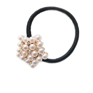 Elegant black elastic hair tie with cluster of pearls and rhinestones