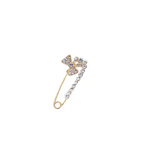 Eleganter goldfarbener Sicherheitsnadel-Broschen-Pin mit glitzernder Schleife