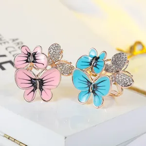 Elegante Schmetterlings-Schal-Schnallen mit Emaille in Pink und Blau und Strasssteinen