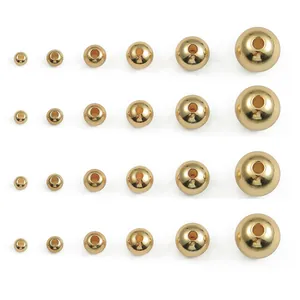 Macro view of 14K gold filled smooth round spacer beads in multiple sizes for DIY